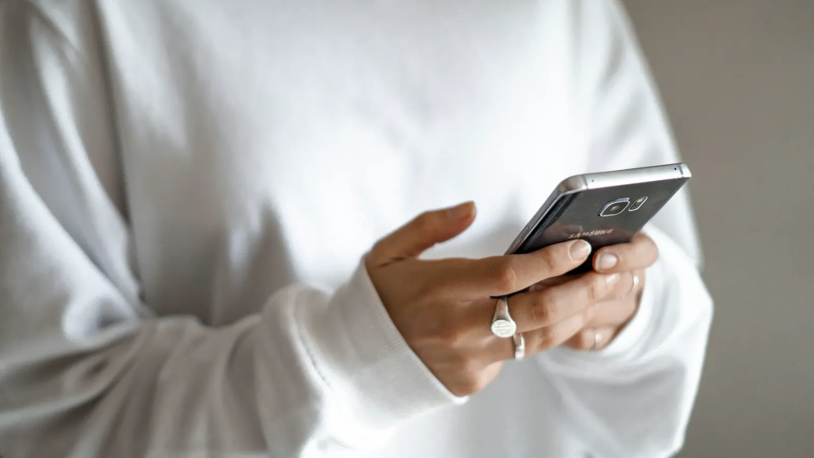 A person typing a message on their phone