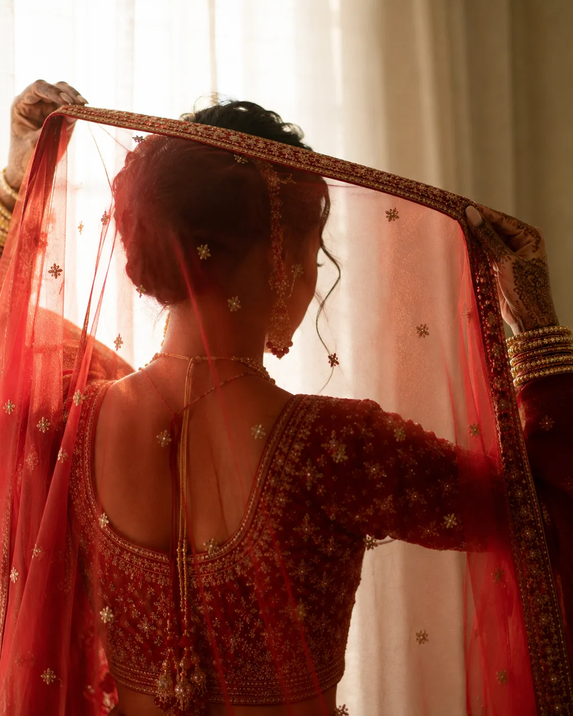 The dupatta settled over the bride's head